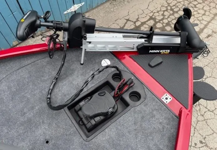 Slide: The Image of 2025 Tracker Savage 215 boat with Minn Kota trolling motor and control panel. - 7