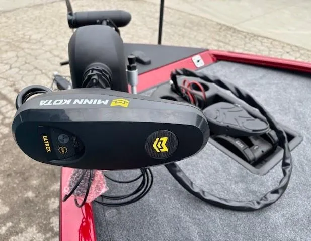 Slide: The Image of 2025 Tracker Savage 215 boat with Minn Kota motor and Garmin display on deck. - 8