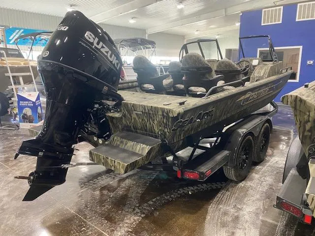 Slide: The Image of 2025 SeaArk Protege boat with Suzuki outboard motor in showroom. - 3