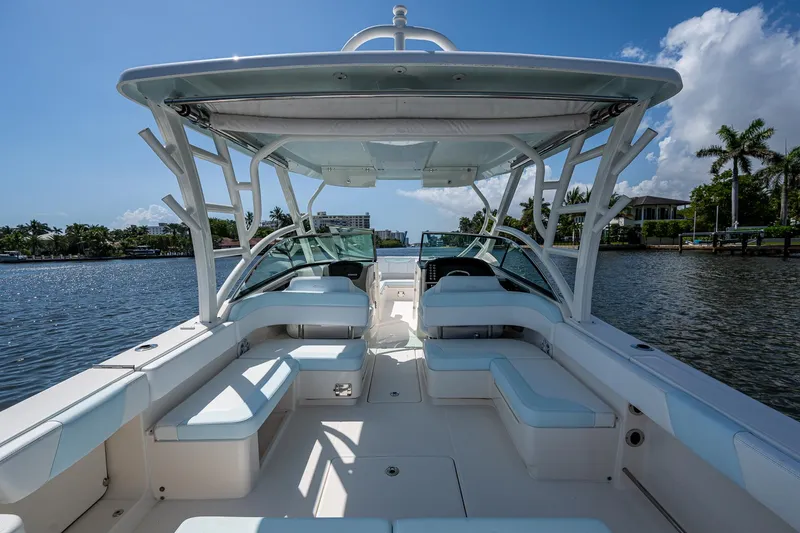 Slide: The Image of 2019 Robalo R317 Dual Console boat with spacious seating on a sunny day. - 20