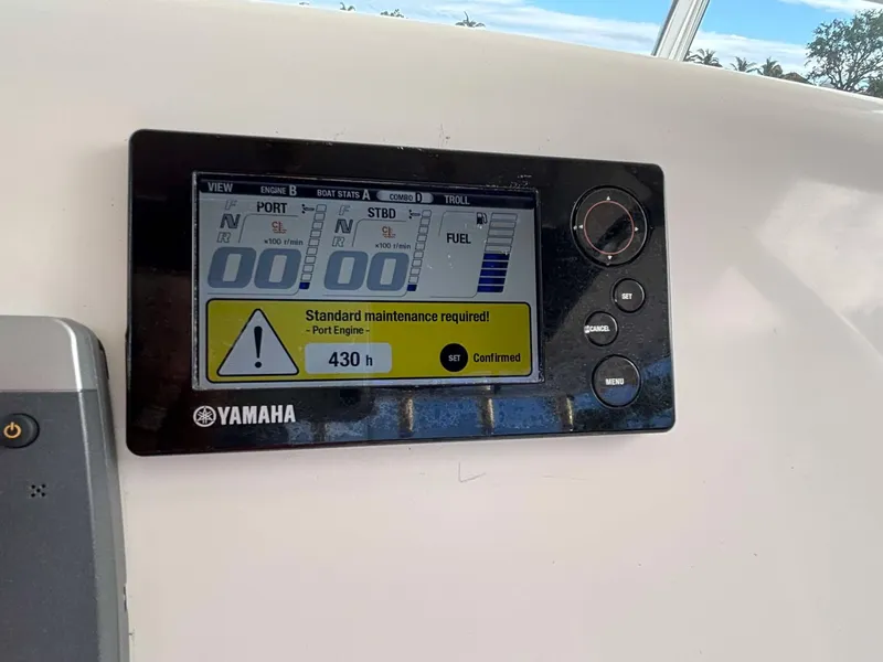 Slide: The Image of Yamaha boat engine display showing maintenance alert on 2012 Edgewater 318CC. - 10