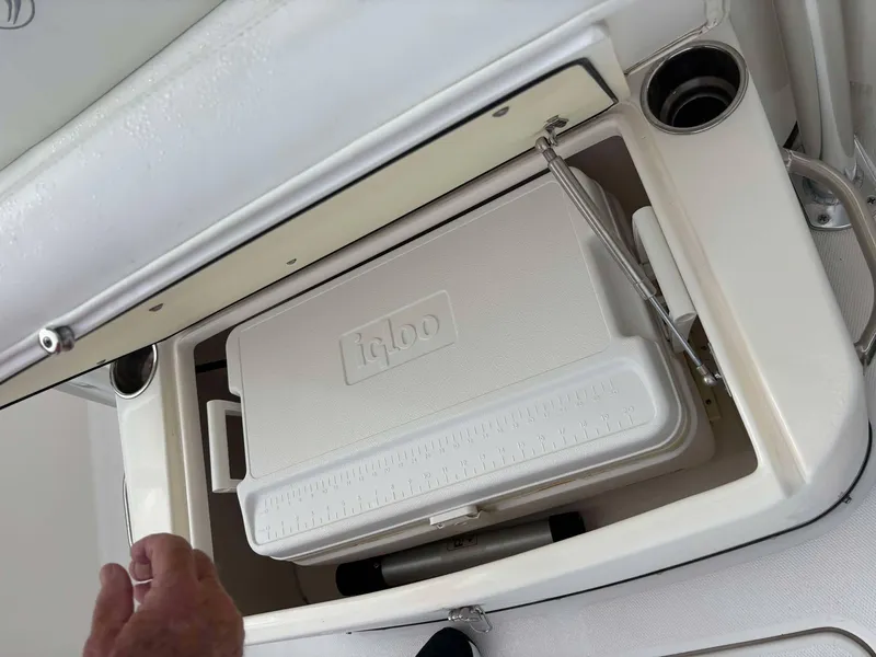 Slide: The Image of Built-in cooler compartment on 2012 Edgewater 318CC boat with Igloo cooler inside. - 15