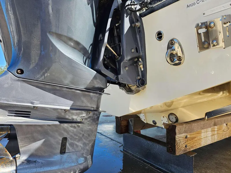 Slide: The Image of Close-up of a 2012 Edgewater 318CC boat engine and transom on a stand. - 20