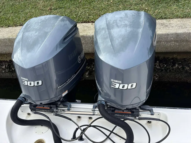 Slide: The Image of Twin Yamaha 300 outboard engines on a 2012 Edgewater 318CC boat. - 22