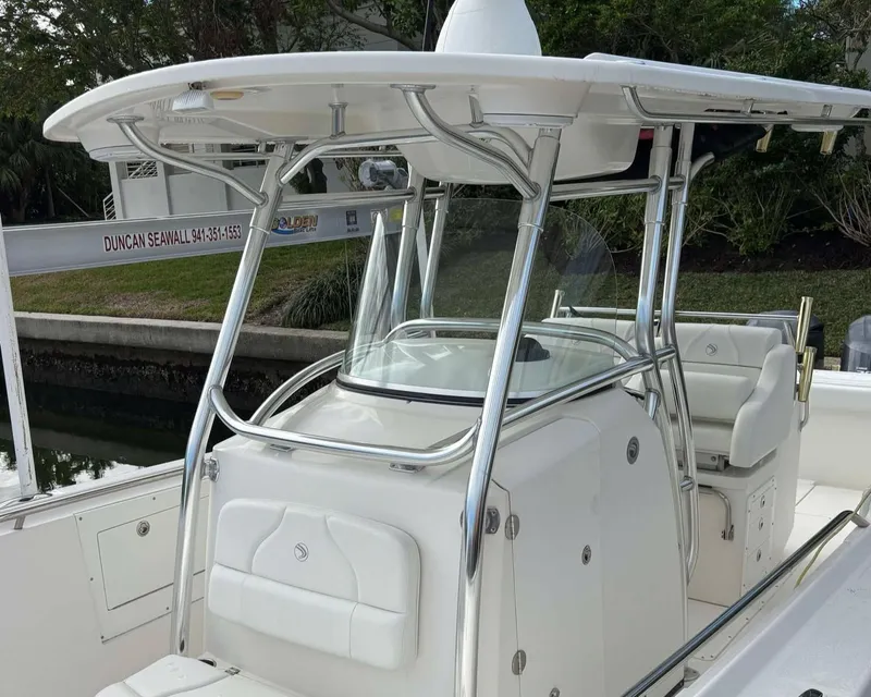 Slide: The Image of 2012 Edgewater 318CC boat with sleek design and sturdy T-top. - 6