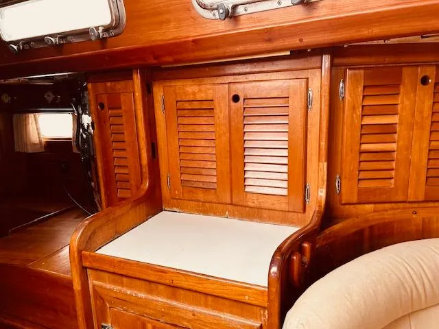 Slide: The Image of Interior of 1990 Bristol 47.7 yacht with wooden cabinetry and seating. - 12