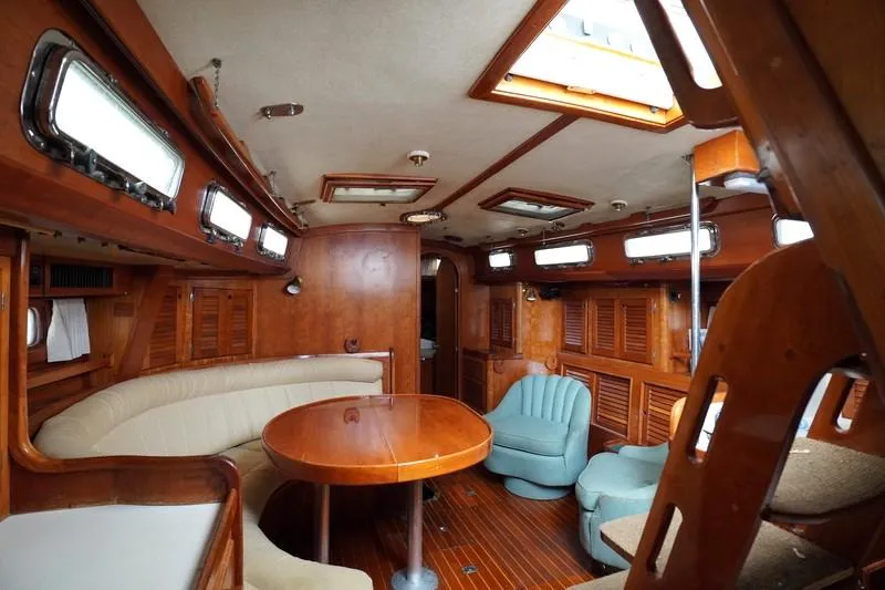 Slide: The Image of Interior of 1990 Bristol 47.7 yacht with wooden furnishings and seating area. - 14