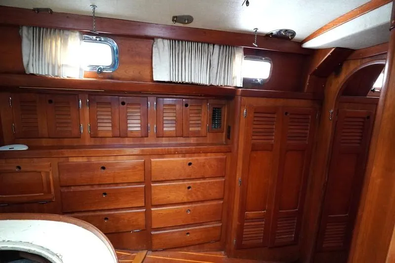 Slide: The Image of Interior of 1990 Bristol 47.7 yacht with wooden cabinetry and porthole windows. - 22