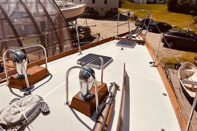 Slide: The Image of Sailboat deck of 1990 Bristol 47.7, featuring polished fittings and hatches. - 30