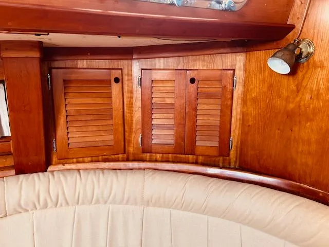 Slide: The Image of Wooden interior of 1990 Bristol 47.7 yacht with louvered cabinets and beige seating. - 4