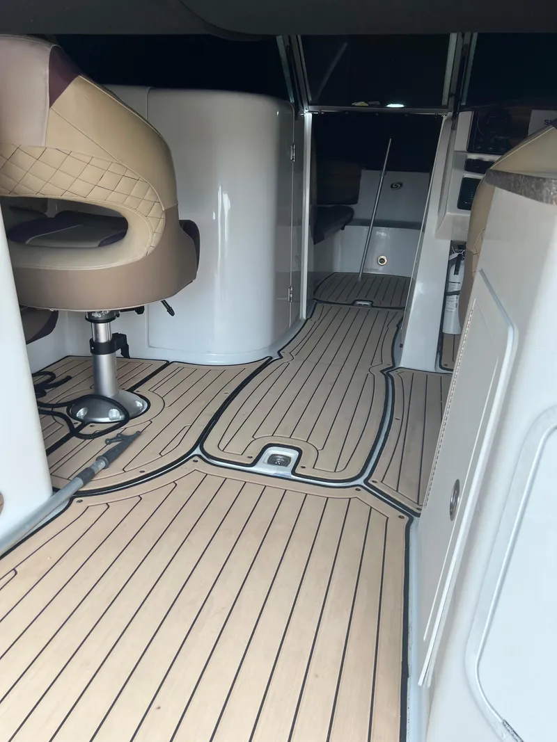 Slide: The Image of 2019 Hurricane SunDeck 2690 OB interior with sleek seating and modern design. - 27