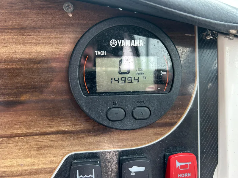 Slide: The Image of Yamaha tachometer on 2019 Hurricane SunDeck 2690 OB, displaying 1499.4 hours. - 31