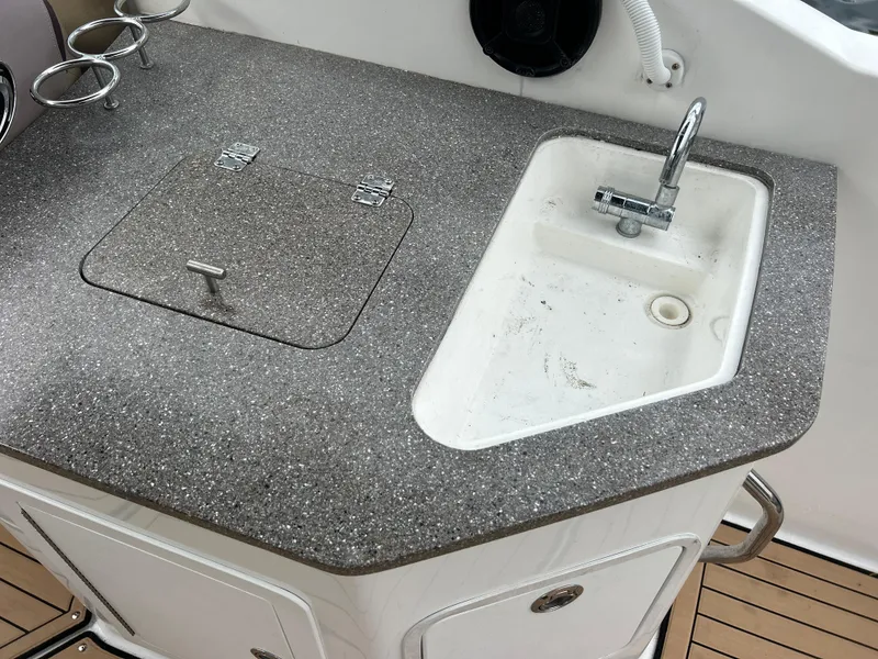Slide: The Image of Boat kitchenette with sink on 2019 Hurricane SunDeck 2690 OB. - 33