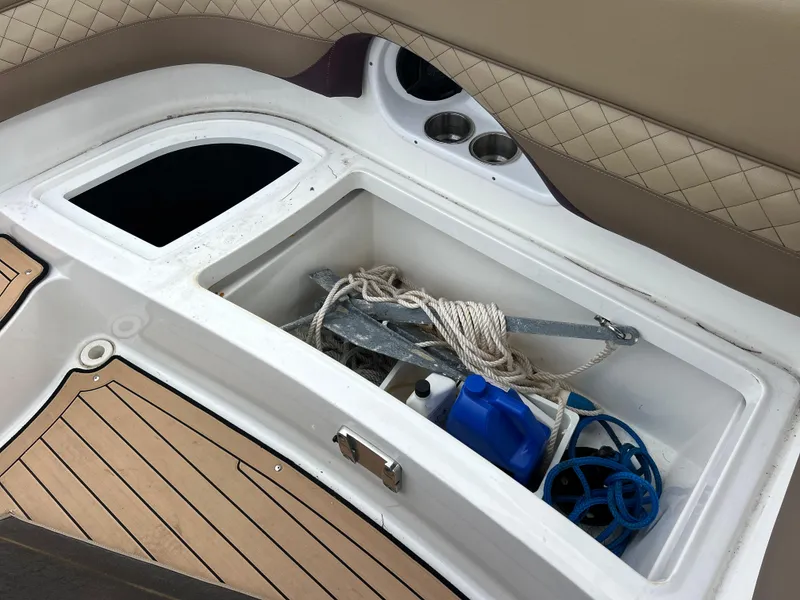 Slide: The Image of Storage compartment on 2019 Hurricane SunDeck 2690 OB boat with anchor and rope. - 37