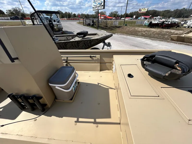 Slide: The Image of 2024 Crestliner 1860 Retriever CC Tunnel boat interior with seating and storage. - 4