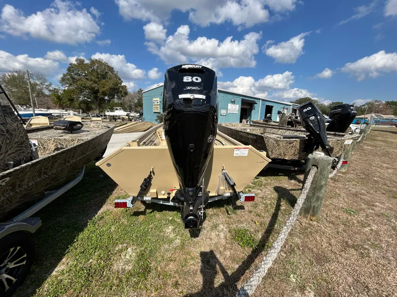 Slide: The Image of 2024 Crestliner 1860 Retriever CC Tunnel boat with 80 HP motor, parked outdoors. - 7