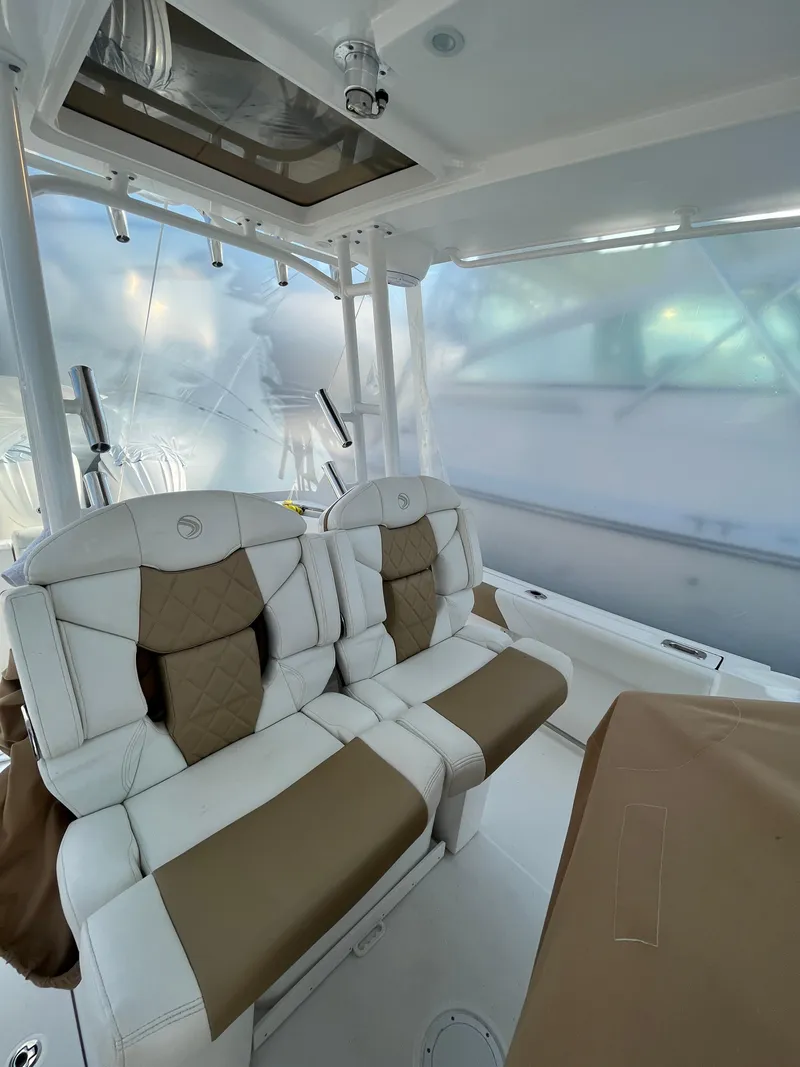 Slide: The Image of 2022 Edgewater 285CC boat interior with plush seating and modern design. - 29