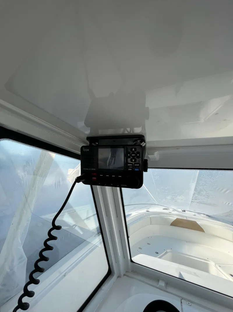 Slide: The Image of 2022 Edgewater 285CC boat interior with mounted navigation equipment. - 45