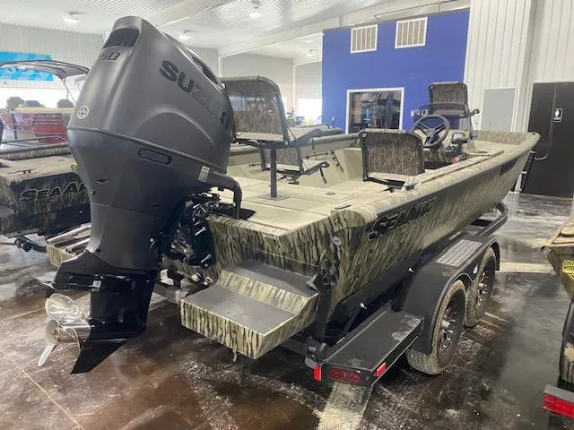 Slide: The Image of 2025 SeaArk Shadow 20 boat with Suzuki outboard motor in showroom. - 3