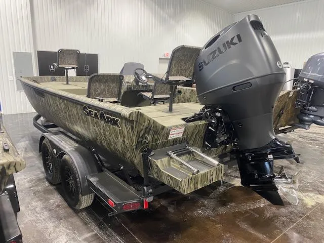 Slide: The Image of 2025 SeaArk Shadow 20 boat with Suzuki outboard motor in a showroom. - 4