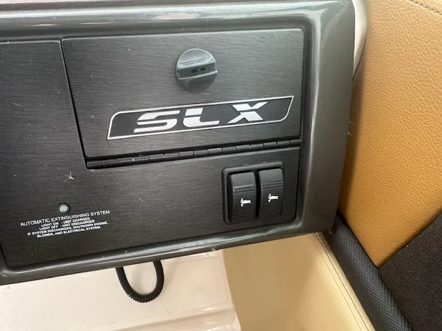 Slide: The Image of Control panel of 2015 Sea Ray 270 SLX boat with SLX branding. - 18