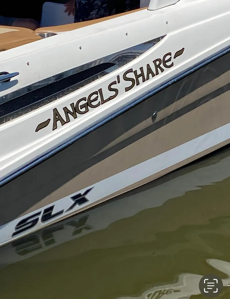 Slide: The Image of 2015 Sea Ray 270 SLX boat named "Angels' Share" on water. - 20