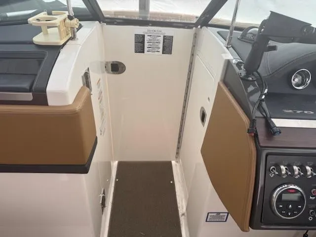 Slide: The Image of 2015 Sea Ray 270 SLX boat interior with control panel and seating. - 7