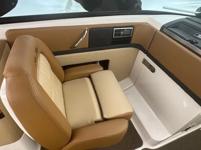 Slide: The Image of 2015 Sea Ray 270 SLX boat interior with tan leather seating and control panel. - 9