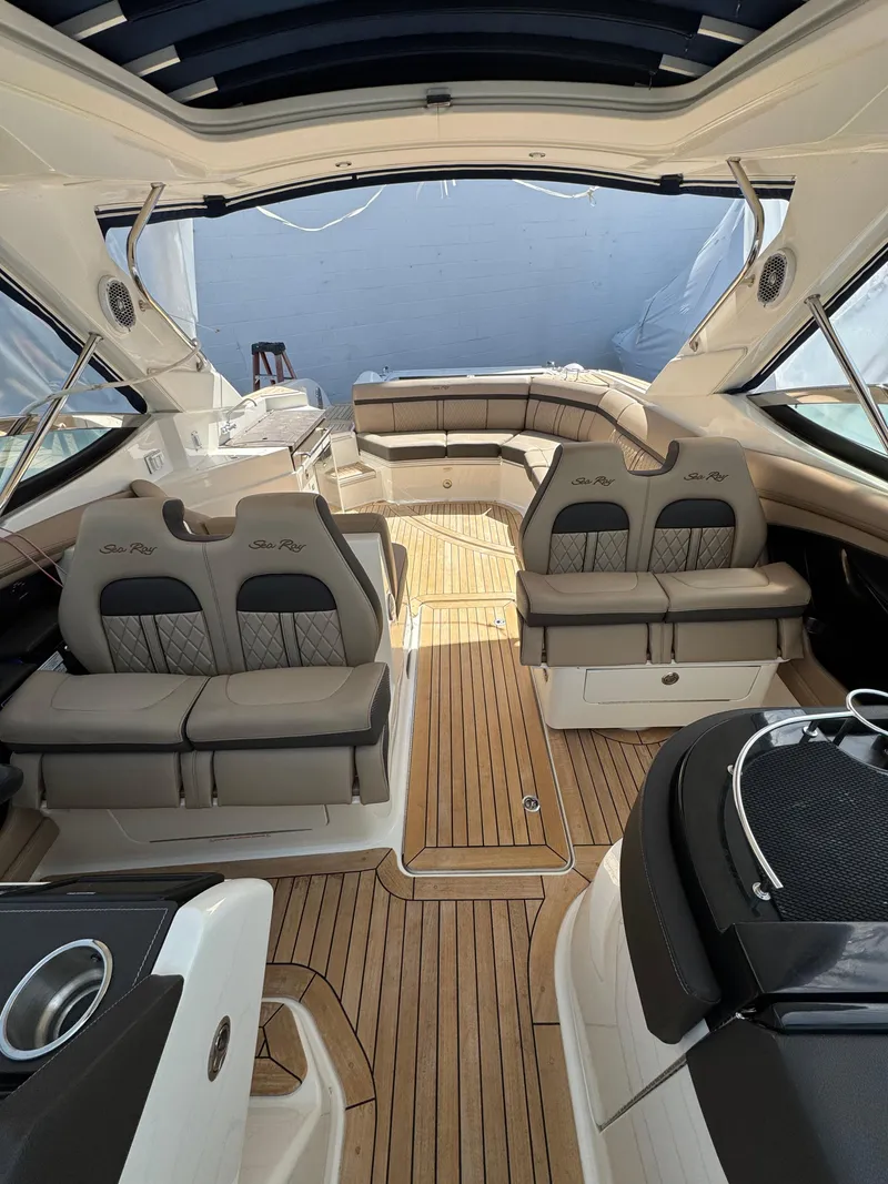 Slide: The Image of 2018 Sea Ray SLX 350 interior with luxurious seating and teak flooring. - 13