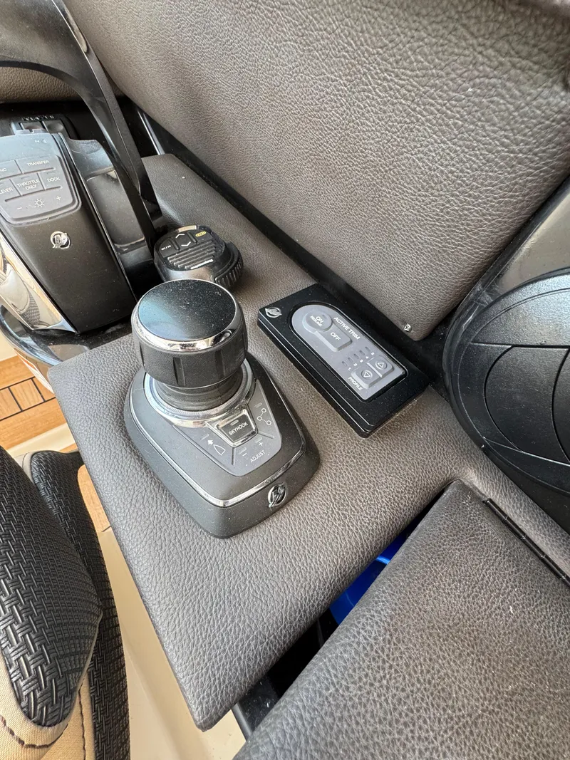 Slide: The Image of 2018 Sea Ray SLX 350 boat controls and joystick on dashboard. - 15