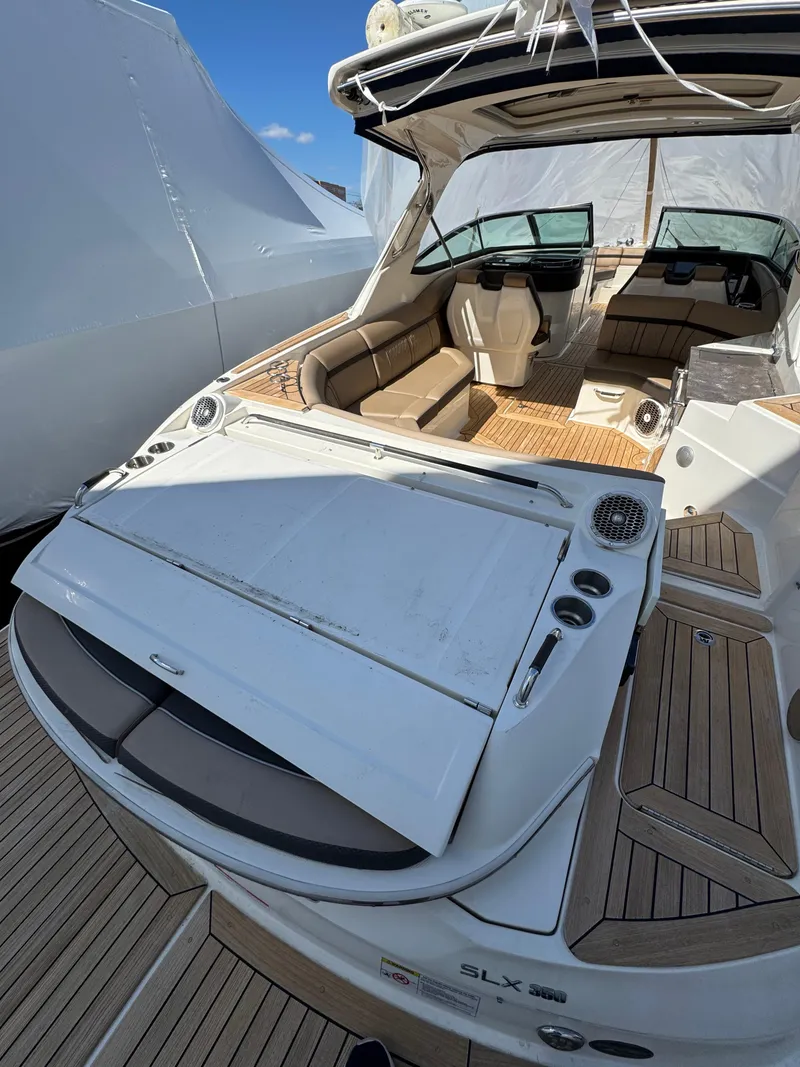 Slide: The Image of 2018 Sea Ray SLX 350 luxury boat with spacious seating and modern design. - 25