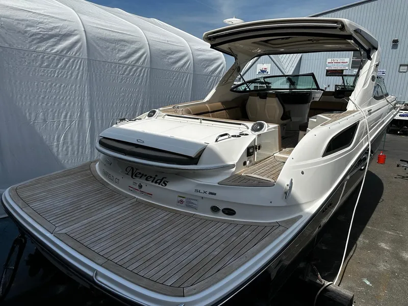 Slide: The Image of 2018 Sea Ray SLX 350 boat with spacious deck and modern design. - 9