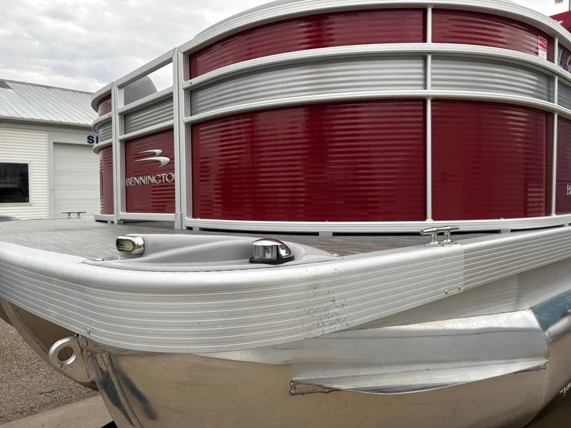 Slide: The Image of 2020 Bennington 22 SLX pontoon boat with red and silver exterior. - 11