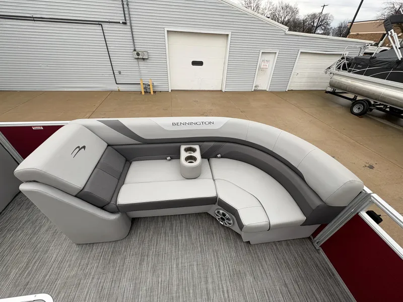 Slide: The Image of 2020 Bennington 22 SLX pontoon boat with gray seating and cup holders. - 17