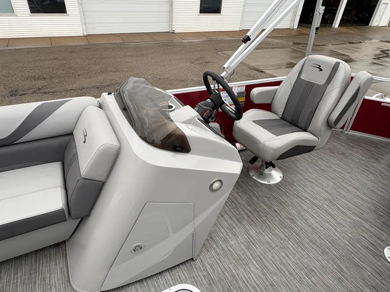 Slide: The Image of 2020 Bennington 22 SLX boat interior with gray seating and steering console. - 19