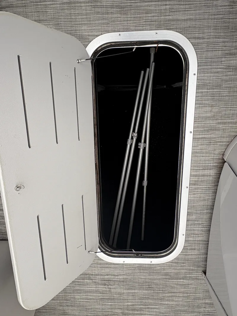 Slide: The Image of Open storage compartment on a 2020 Bennington 22 SLX boat, showing interior space. - 21