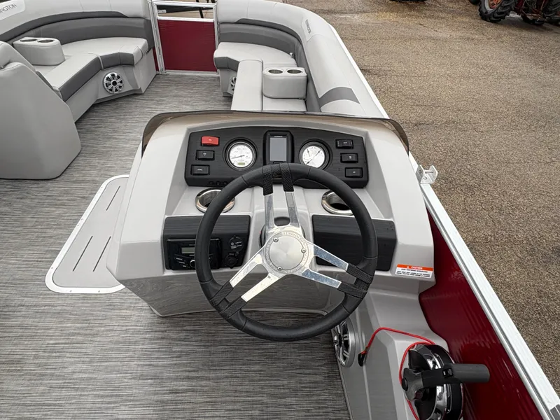 Slide: The Image of 2020 Bennington 22 SLX boat dashboard with steering wheel and controls. - 22