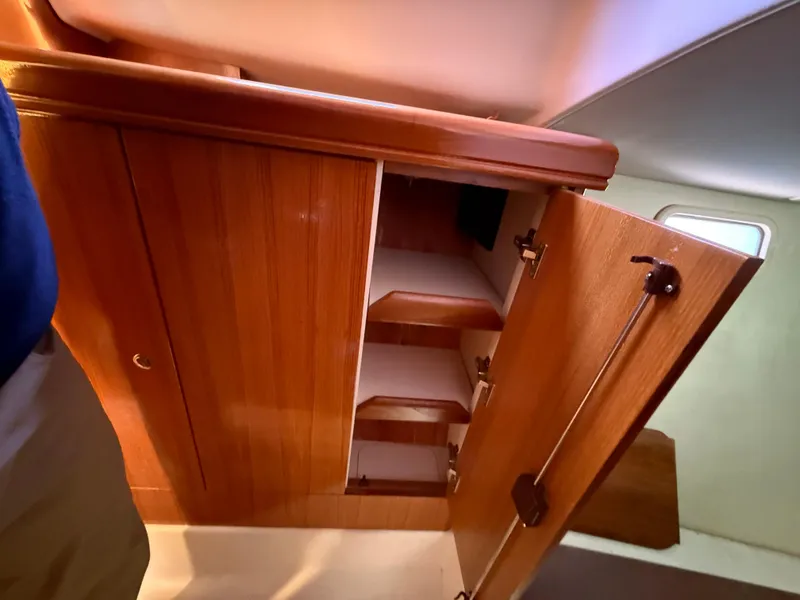 Slide: The Image of Wooden cabinet interior on a 2007 Hunter 33 sailboat. - 26