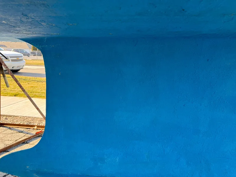 Slide: The Image of Bottom view of a 2007 Hunter 33 sailboat hull, painted blue. - 33