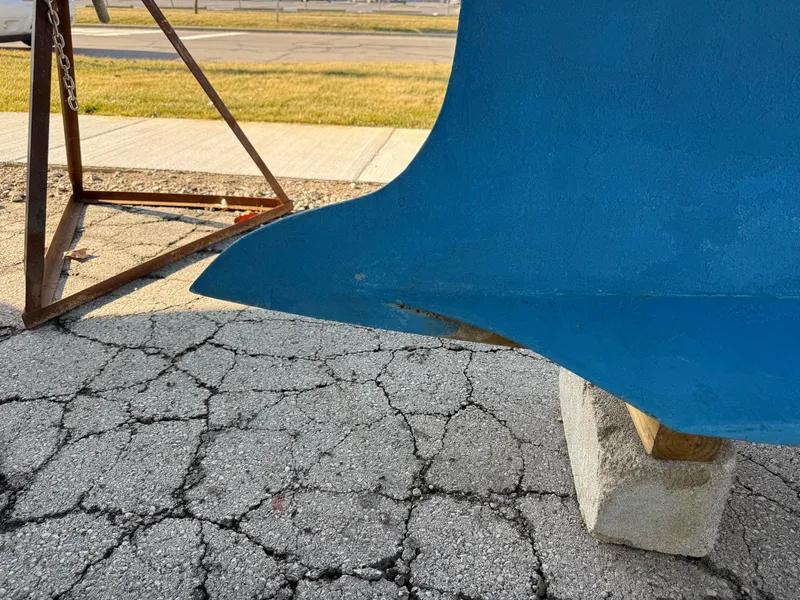 Slide: The Image of Keel of a 2007 Hunter 33 sailboat on cracked pavement. - 35