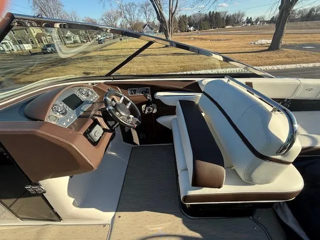 Slide: The Image of 2016 Regal 2800 Bowrider interior with steering wheel and seating, showcasing luxury design. - 11