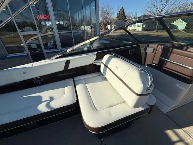 Slide: The Image of 2016 Regal 2800 Bowrider interior with white seating and open sunroof. - 12