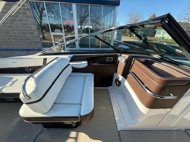 Slide: The Image of 2016 Regal 2800 Bowrider interior with white and brown seating, modern design. - 13