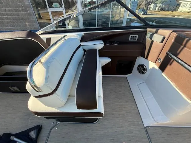 Slide: The Image of 2016 Regal 2800 Bowrider interior with brown and white seating, modern design. - 14