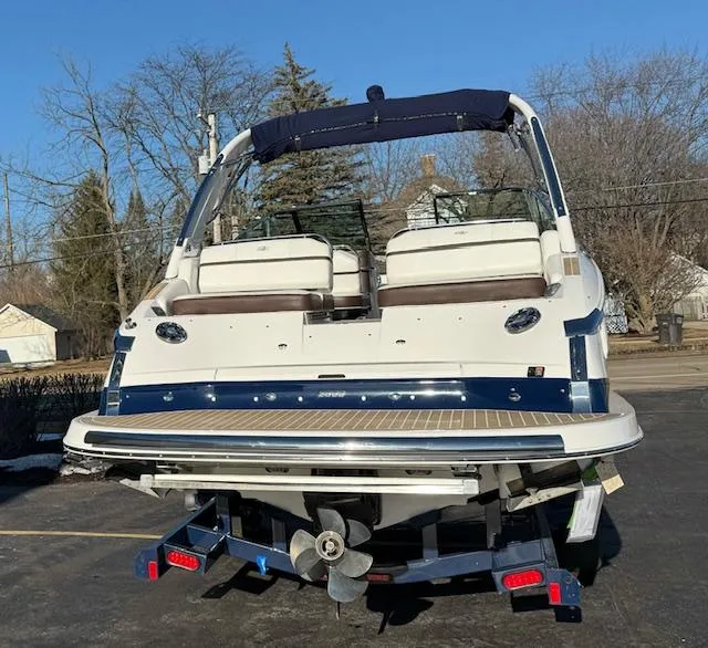 Slide: The Image of 2016 Regal 2800 Bowrider boat on trailer, rear view, sunny day. - 2