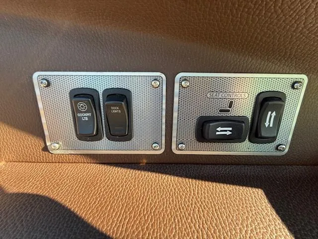 Slide: The Image of Control panel of a 2016 Regal 2800 Bowrider boat with cockpit and seat controls. - 26