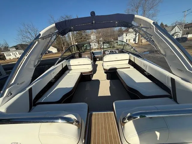 Slide: The Image of 2016 Regal 2800 Bowrider boat with spacious seating and sleek design. - 31