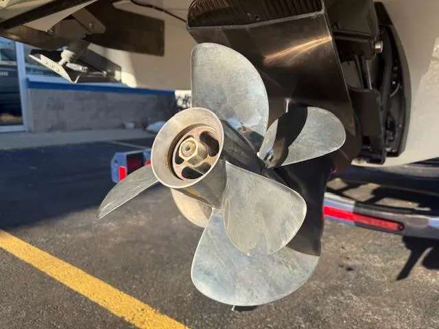 Slide: The Image of Close-up of a 2016 Regal 2800 Bowrider boat propeller in a parking lot. - 34