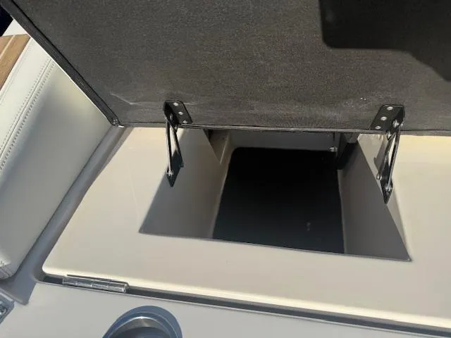 Slide: The Image of Open storage compartment in 2016 Regal 2800 Bowrider boat interior. - 37