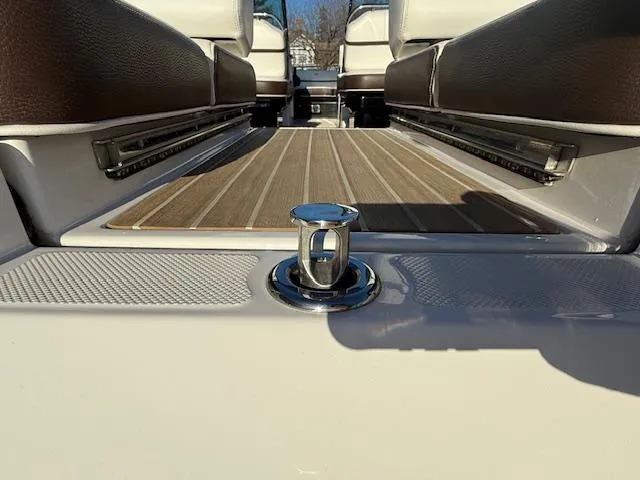 Slide: The Image of 2016 Regal 2800 Bowrider boat interior with teak flooring and seating. - 39